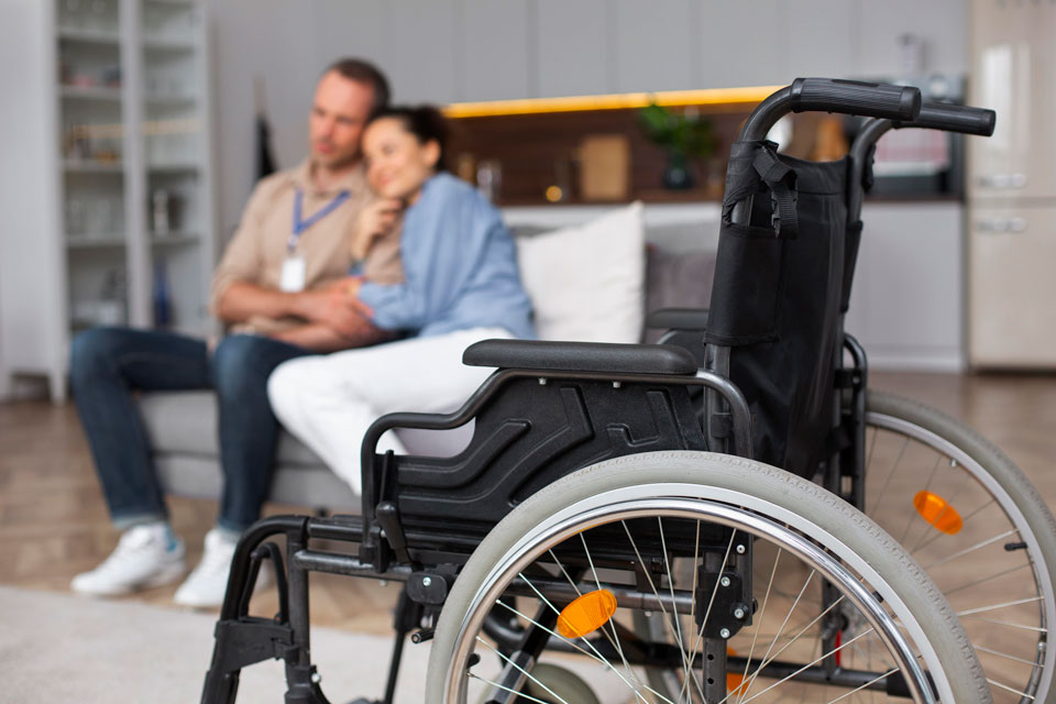 Wheel chair with couple on sofia